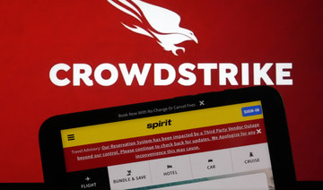 The logo for CrowdStrike and a Spirit Airlines webpage are shown on a computer screen in New York. (AP)