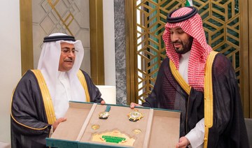 Saudi Crown Prince Mohammed bin Salman is presented with the Leader’s Medal by the Speaker of the Arab Parliament in Jeddah.