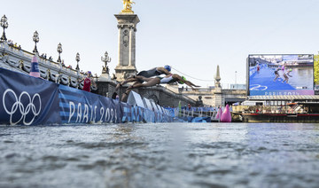 Olympic marathon swim test run is canceled over water quality concerns for Seine River